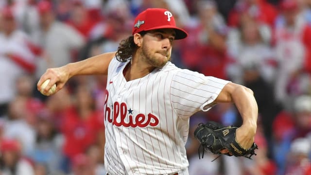Oct 11, 2023; Philadelphia, Pennsylvania, USA; Philadelphia Phillies starting pitcher Aaron Nola (27) pitches during the third inning against the Atlanta Braves in game three of the NLDS for the 2023 MLB playoffs at Citizens Bank Park.